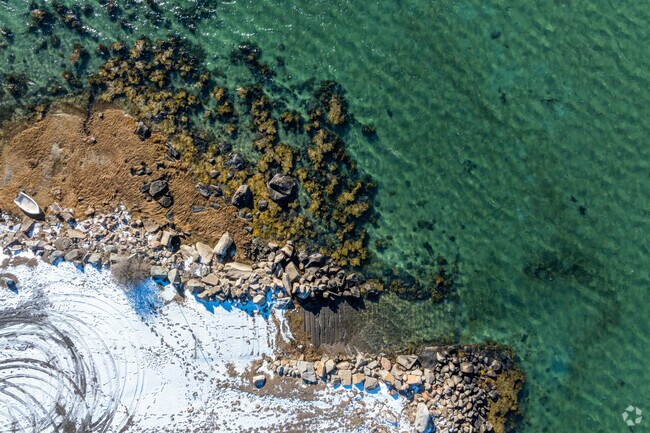 A unique straight down view of a snow covered Corliss Landing boat ramp in Gloucester, MA.
