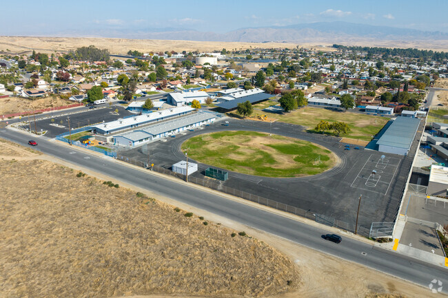 The track field at Hort elementary can be found on the SW side of the school grounds.