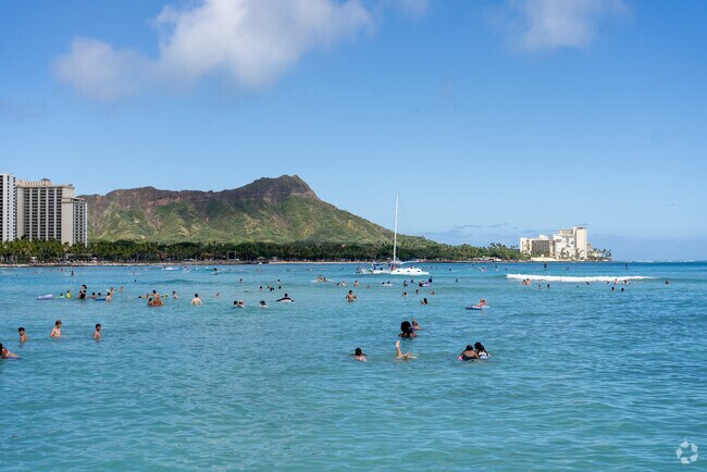 Cool off in the Pacific Ocean at Waikiki Beach.