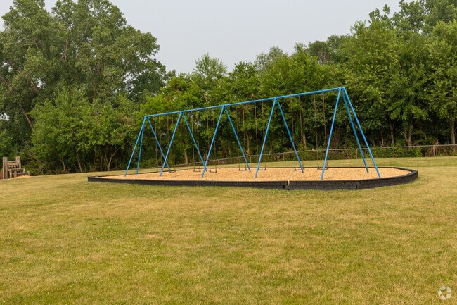 James H Watson Elementary School swing set with open play grassy areas, Schererville, IN.