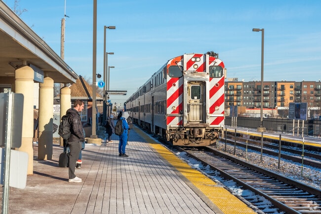 Downtown commuters wait for the Metra train at Wheeling Station.