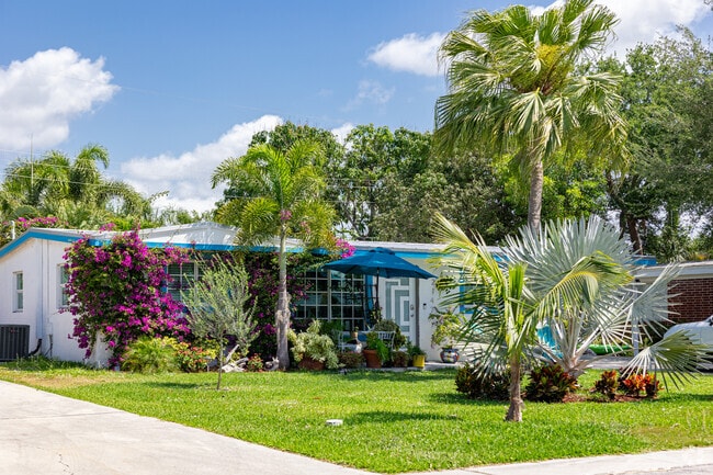 Spanish Revival homes with lush landscaping are a common sight in East Naples.