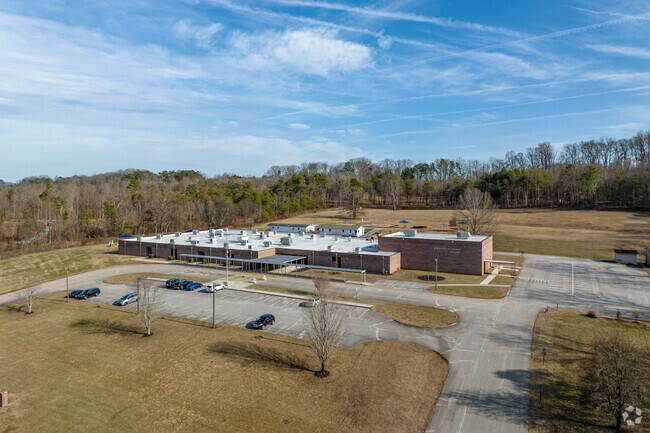 Middle settlements Elementary has a parking lot in front of the school.