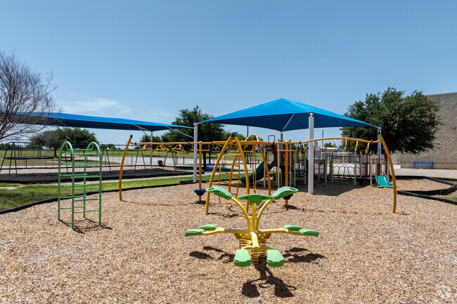 Students at James E. Mitchell Elementary School can enjoy covered play grounds.