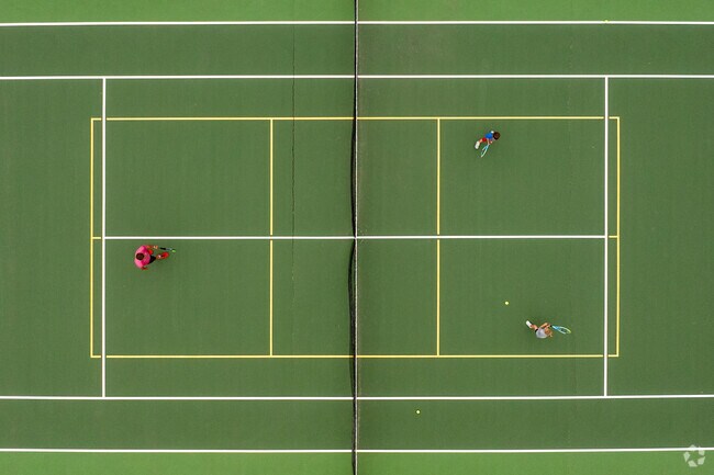 Players rally under bright skies at the tennis courts in O'Hauser Park, a Fox Crossing favorite.