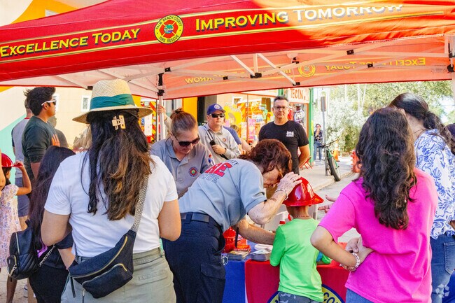 Local firefighters participating in the annual Street Painting Festival