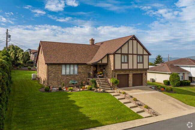 Tudor revival homes with two car garages are unique and functional in Hughestown.
