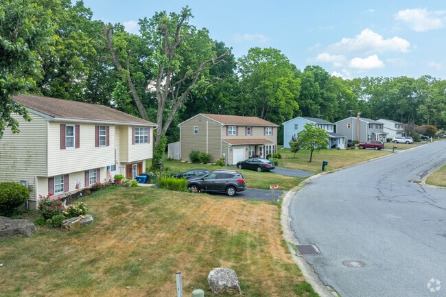Winding residential streets in Farmdale have various architectural styles, including bi-levels.