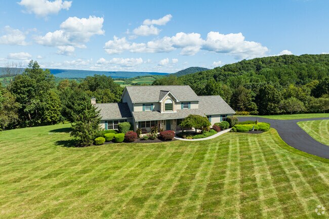 Albany country homes often sit on 3 to over 10 acres with long driveways.