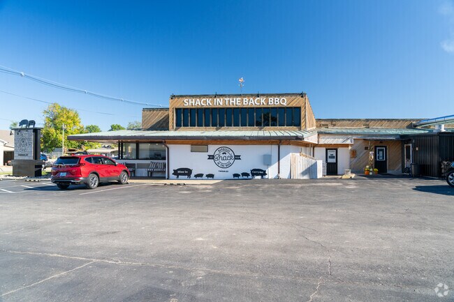Shack in the Back BBQ features a rustic dining room with industrial finishes.