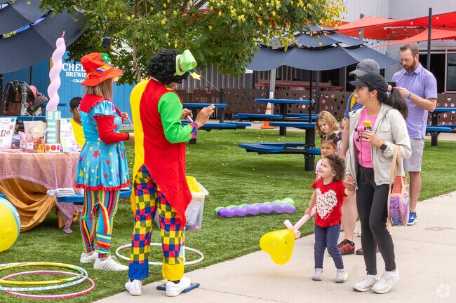 Clowns entertain families at a weekend event in Stanley Marketplace, North Aurora.
