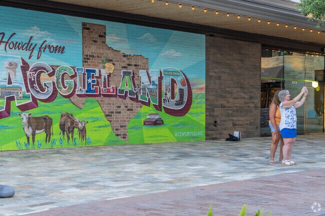 The Aggieland mural becomes a photo spot for Briarcrest locals.