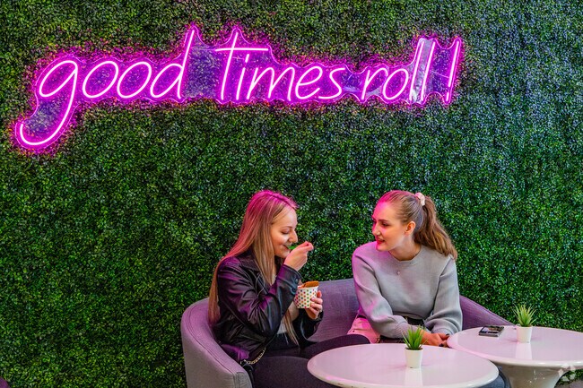 A couple of young girls enjoy hand rolled ice cream at I.CE.NY in Baldwin Park.