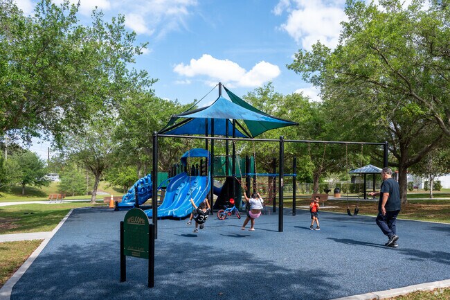 Lockhart families enjoy the playground at Riverside Acres Park.