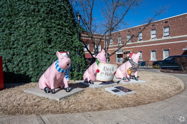 The pigs are dressed and ready for carols in downtown Lexington, NC.