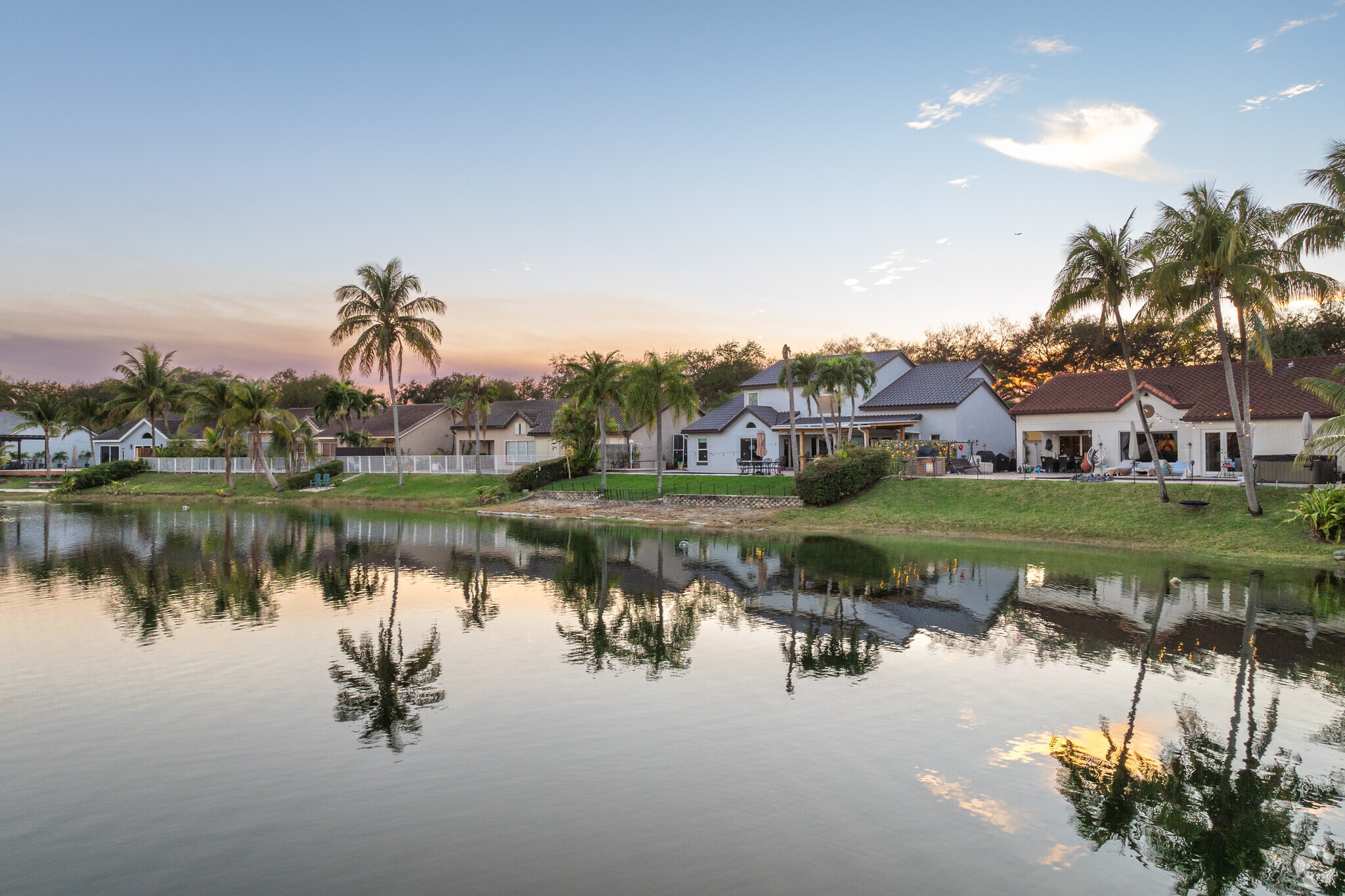 Marvel at the picturesque row of homes with a serene lakefront view in Lakes on the Green.