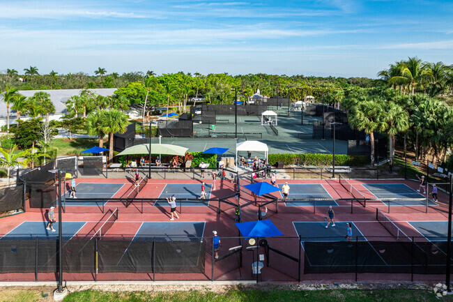 Fiddler’s Creek offers tennis courts and pickleball facilities for active residents.