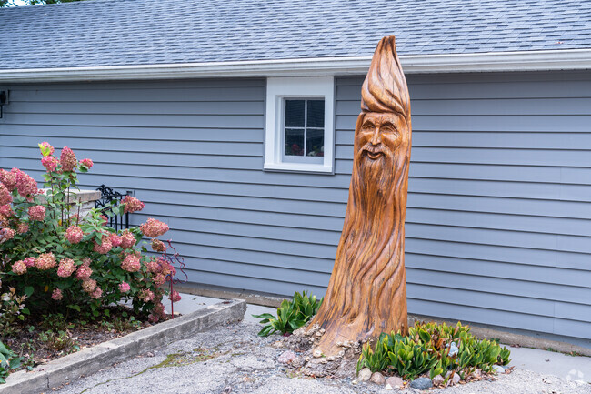 A very unique wood tree sculpture can be found in the heart of Duck Lake neighborhood.
