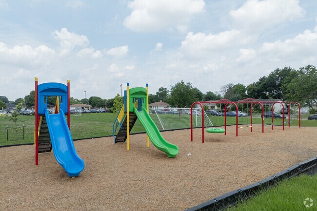 The campus includes a large playground and garden area.