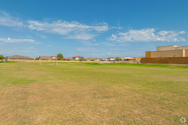 The school kids have ample room to play in the open field at Fine Arts Academy.