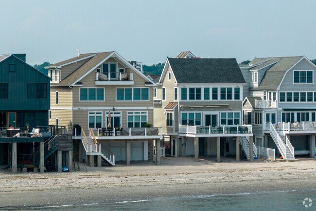 Relax on the deck of your new Devon beach house