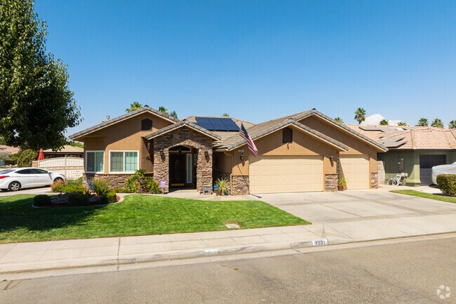 New Traditional homes with green grass welcome residents in North Madera.