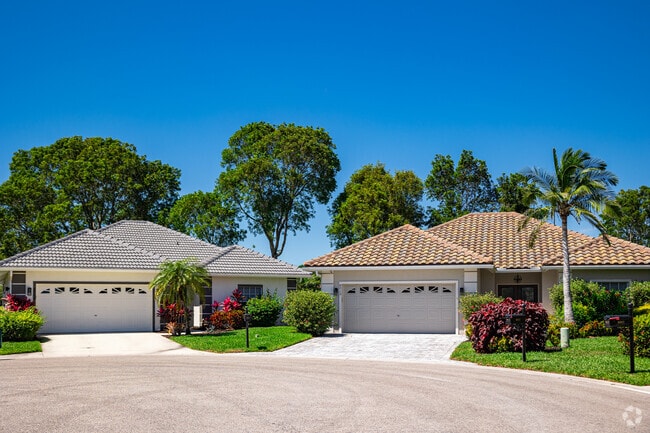 Lely Resort housing options include single family homes with well-manicured landscaping.