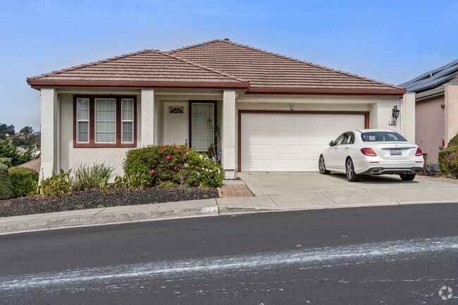Portola Highlands features charming bungalow homes with modern stucco exteriors and clean lines.
