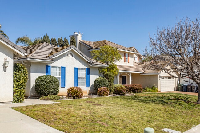 Neatly maintained Homes in East Grove are lined up with driveways and front yards.