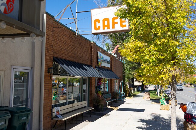 Cozy cafés line Parowan’s Main Street, framed by trees in autumn hues.