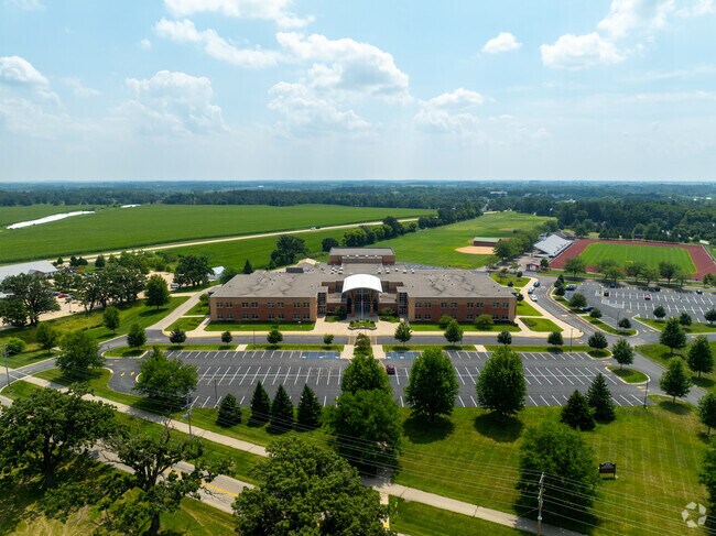 Badger High School’s campus includes a football field and a baseball diamond in the background.