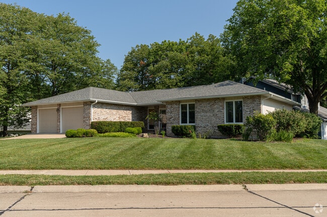 Modern brick ranchers sit proudly on corner lots throughout Green Meadows.