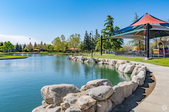 Paved walkway borders the large lake at Del Lago Park in Northeast Tulare.