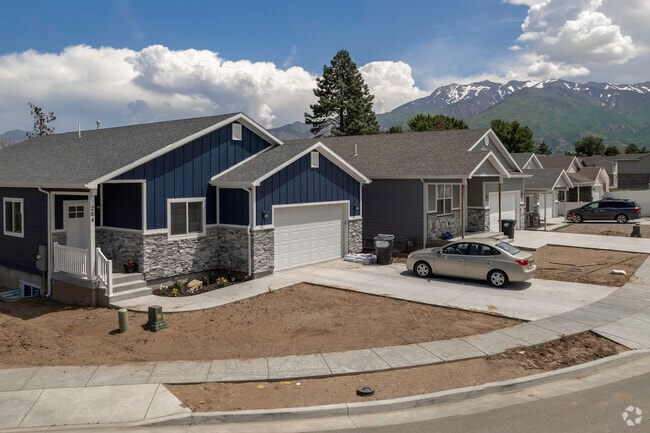 A beautiful blue home with gray stone details in Washington Terrace.