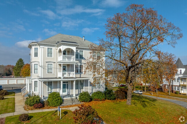 A Victorian house illuminated by afternoon sunlight in the Manville-Albion neighborhood, RI.