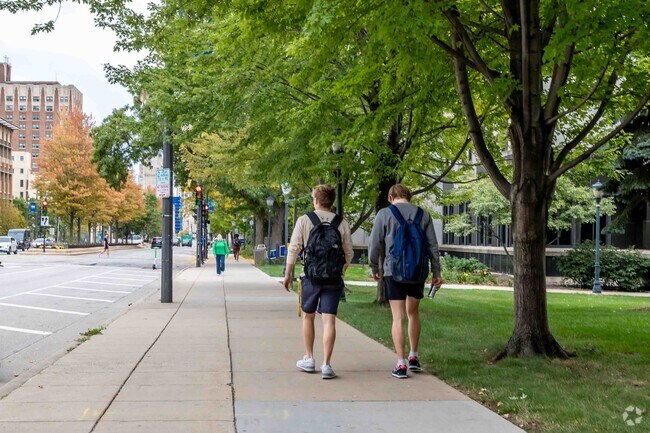 Folks take a walk near Marquette University and see all that Avenues West has to offer.