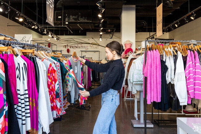 Locals shop for clothes at Threshing Bee in the Prairiefire shopping area.