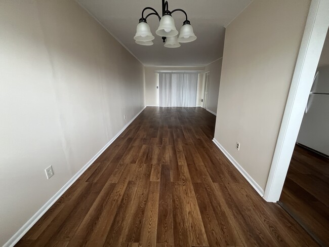 Living room/Dining combo facing towards balcony