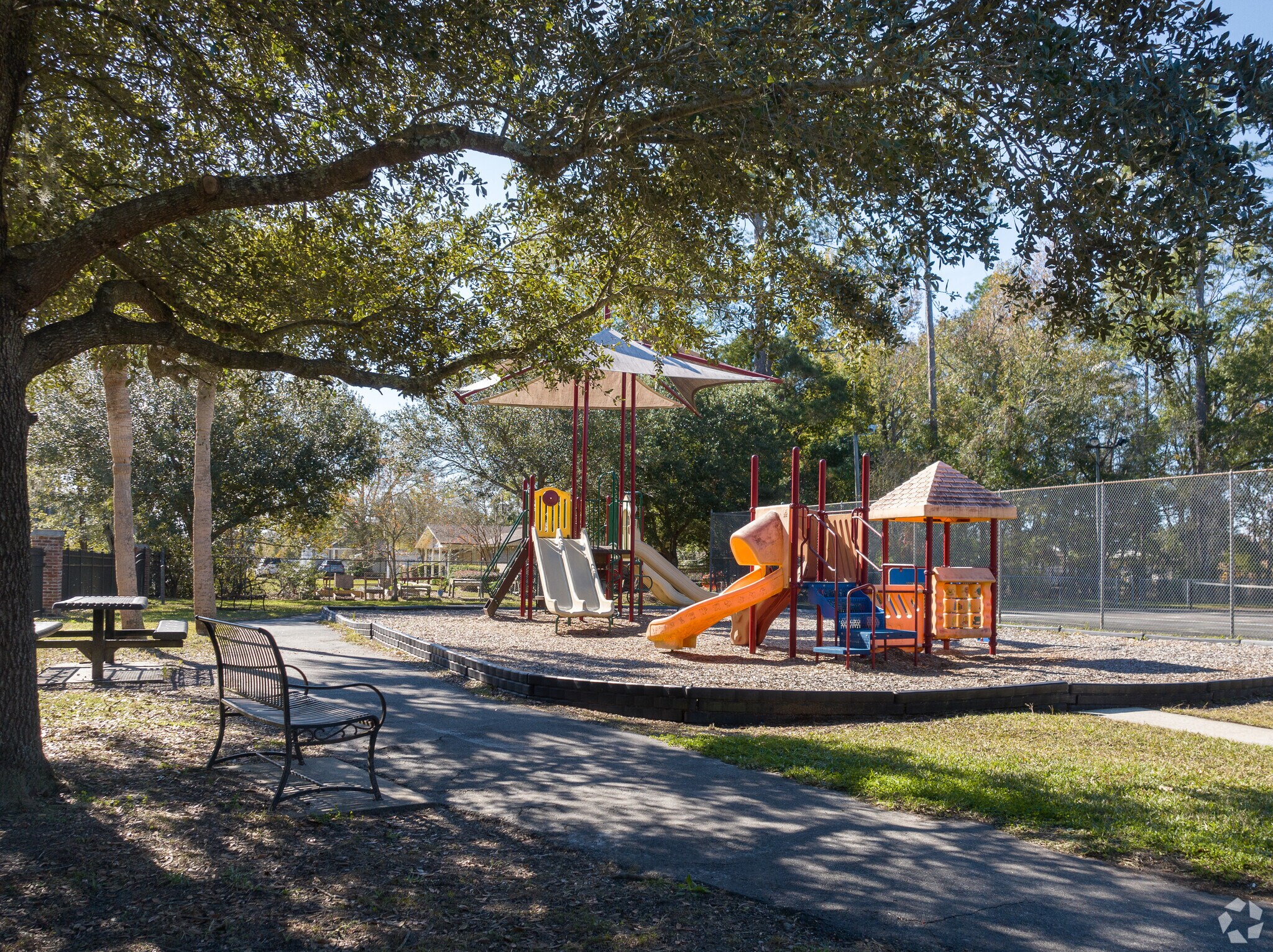 Nice oak trees shade the benches at Ewing Park.