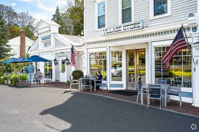 Neighbors gather outside Bridgewater Village Store & Bistro on Main Street.