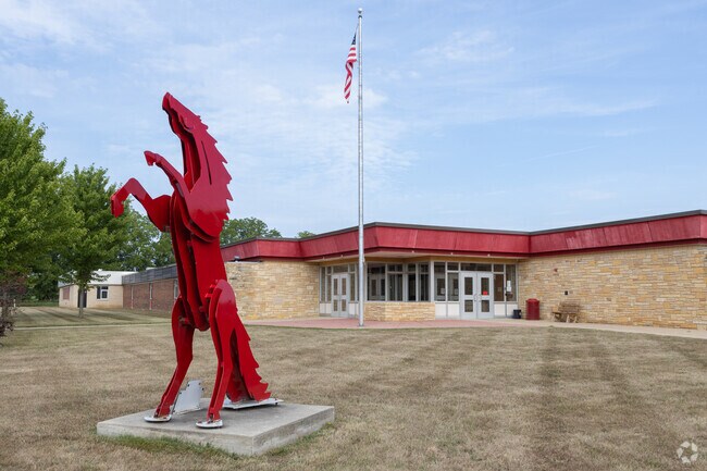 Entrance to Bellevue Jr/Sr High school with horse statue in front in Bellevue.