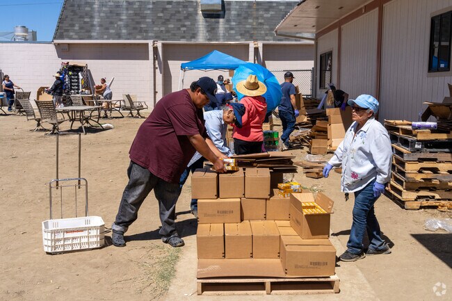 Volunteers distribute food at the Huron Neighborhood Resource Center.