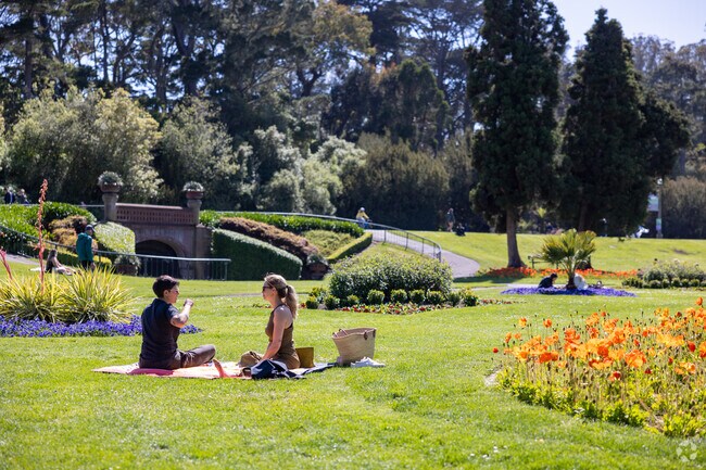 Friends enjoy a delightful picnic in nearby Golden Gate Park, near Lone Mountain.