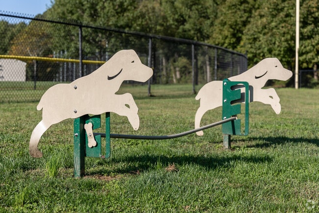 Adjust the height of the dog jump at Fenton Lane Park in Chesterfield Township.