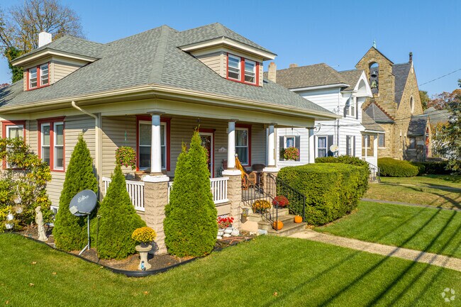 Sloped roofs, covered porches, and large windows mark the bungalow architecture in Newfield.