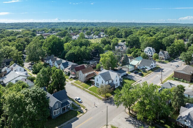 Homes of Hanna, Lafayette are shaded by large trees along clean streets and nearby parks.