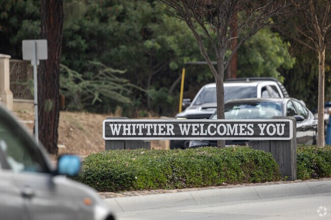Welcome signs at Whittier's entry points display the 
