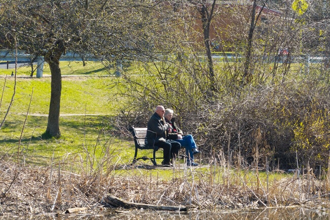 A couple sits and enjoys the morning in Buckingham Lake-Crestwood.
