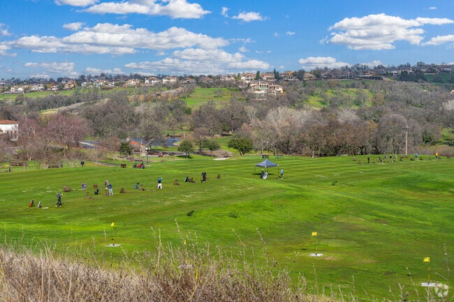 Large group gathers at the Catta Verdera Country Club driving range in Verdera Village.