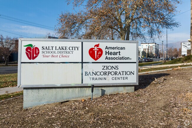 A concrete sign sits in front of Salt Lake Virtual School.